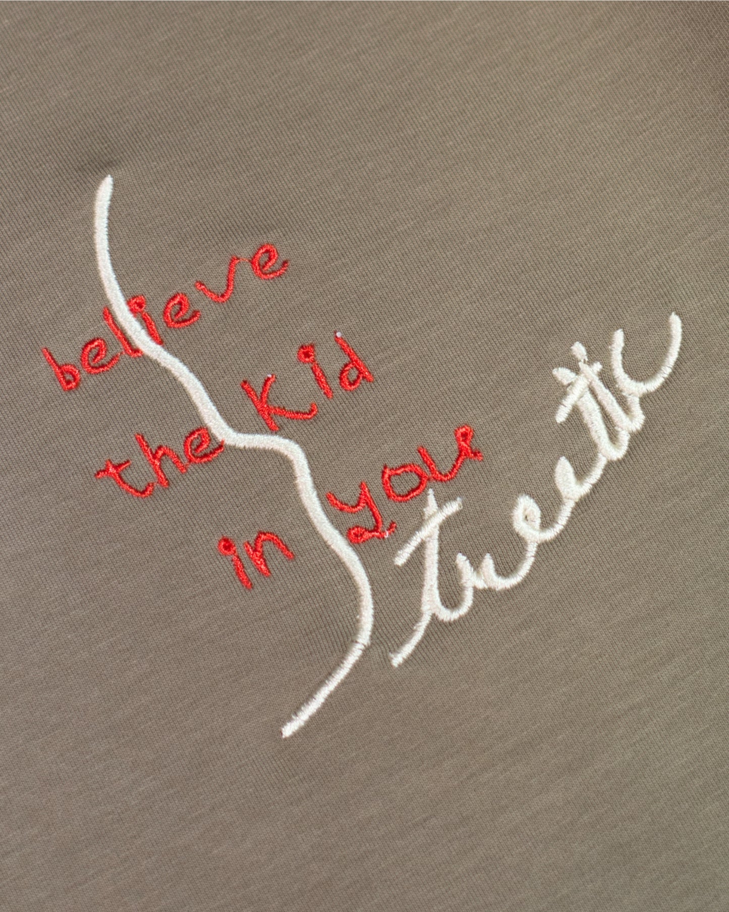 BELIEVE THE KID IN YOU EMBROIDERED KHAKI POLO