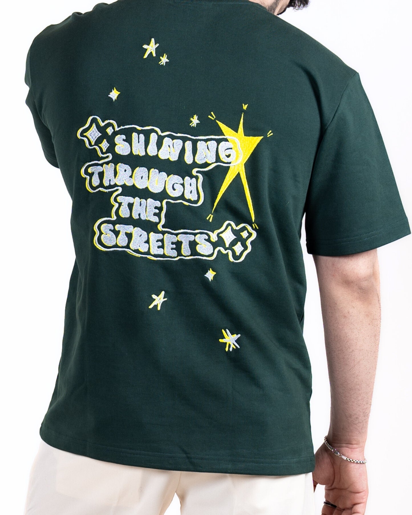 SHINING THROUGH THE STREETS EMBROIDERED BOTTLE GREEN T-SHIRT
