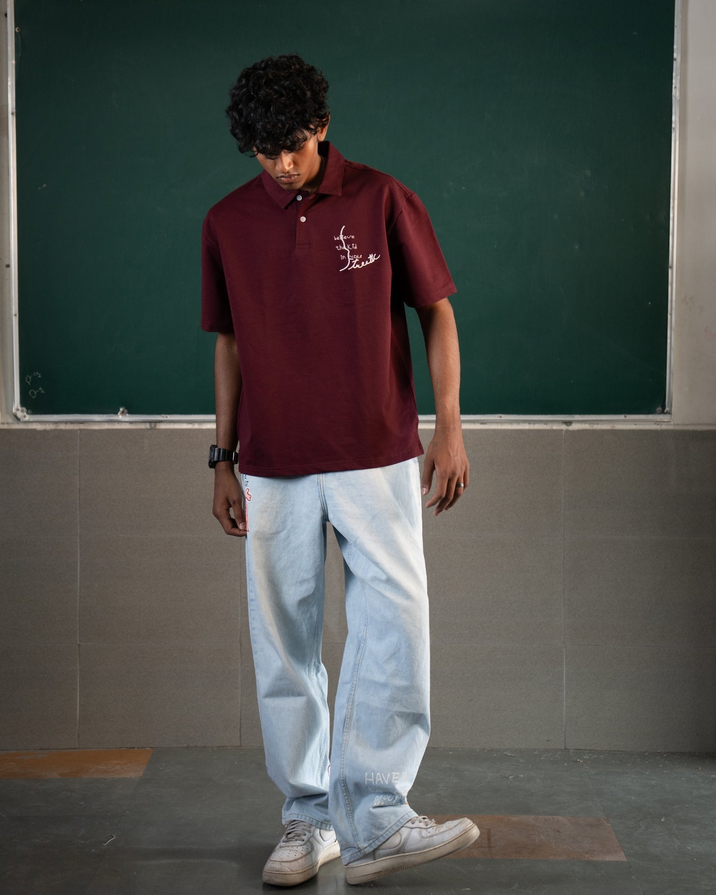 BELIEVE THE KID IN YOU EMBROIDERED WINE POLO
