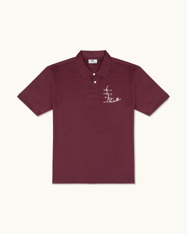 BELIEVE THE KID IN YOU EMBROIDERED WINE POLO